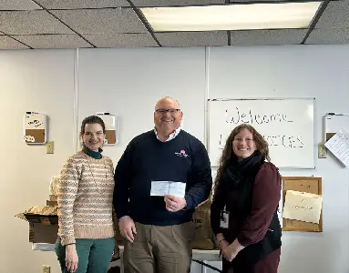 Molly Maid Columbus East presenting a check to CHOICES.