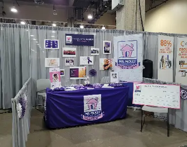 Molly Maid booth set up at a trade show.