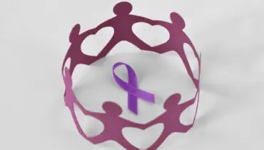 Paper people in a circle around violet ribbon