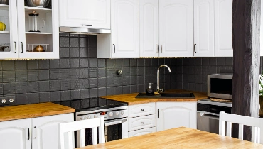 Kitchen with butcher block counter tops.