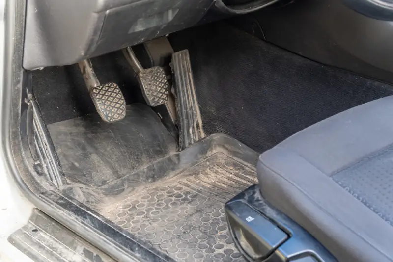 Car interior full of sand.