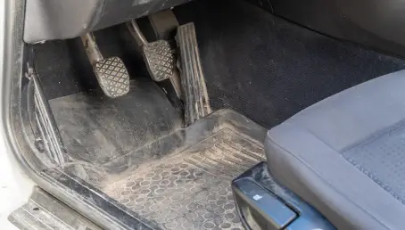 Car interior full of sand.